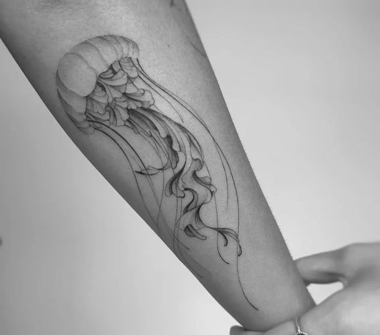 Medium Black and Grey Jellyfish Tattoo on Women Arm by @etratattoo.studio