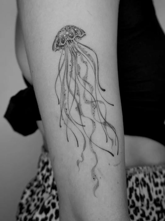 Medium Black and Grey Jellyfish Tattoo on Women Arm by @kintintattoo