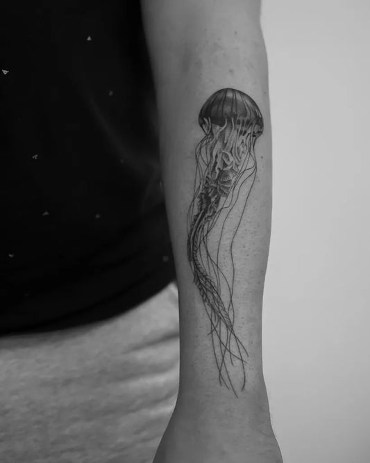 Medium Black and Grey Jellyfish Tattoo on Women Arm by @merievermeij