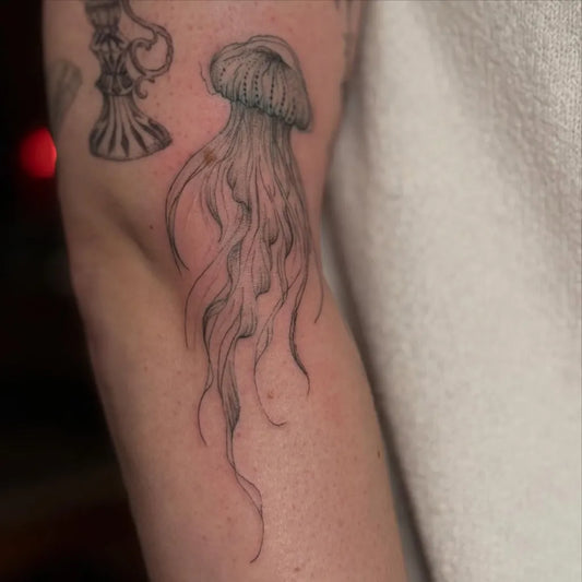 Medium Black and Grey Jellyfish Tattoo on Women Arm by @sushiiimilktattoo