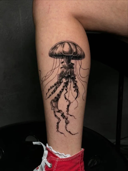 Medium Black and Grey Jellyfish Tattoo on Women Leg by @cleopatraink.jax
