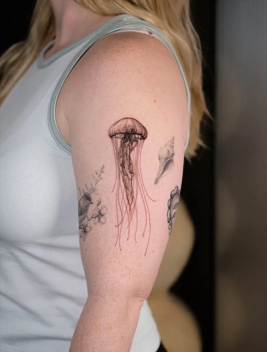 Medium Black and Grey Jellyfish and Flowers Tattoo on Women Arm by @law_ink