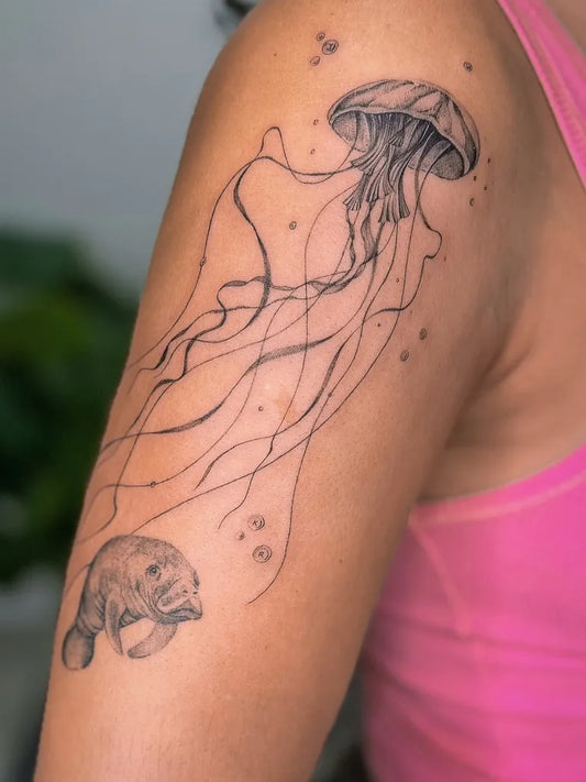 Medium Black and Grey Jellyfish and Manatee Tattoo on Women Shoulder by @lgbeautyink