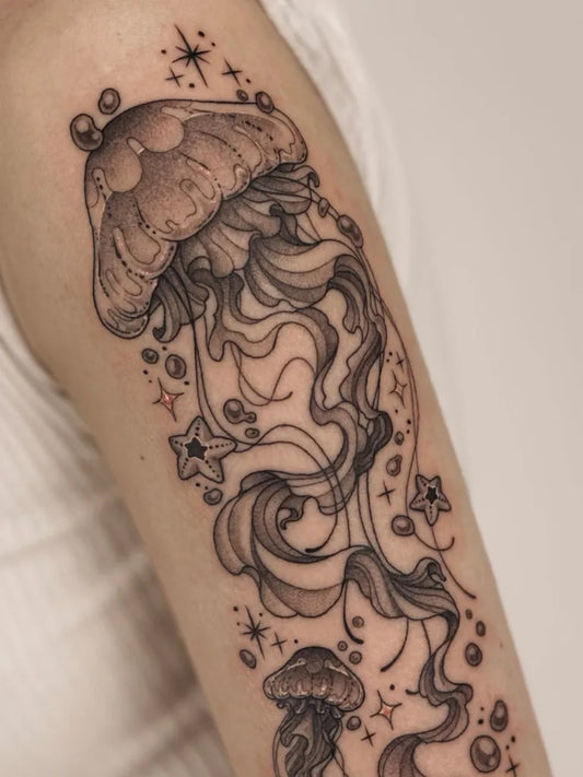 Medium Black and Grey Jellyfish and Stars Tattoo on Women Arm by @takko.san