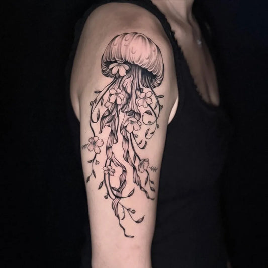 Medium Black and Grey Jellyfish with Flowers and Vines Tattoo on Women Shoulder by @killakate_tattoos