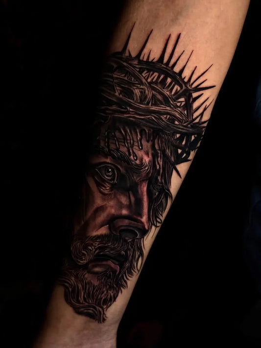 Medium Black and Grey Jesus with Crown of Thorns Tattoo on Men Arm by @am_tattoos