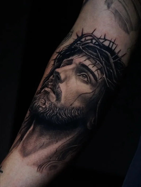 Medium Black and Grey Jesus with Crown of Thorns Tattoo on Men Arm by @saqra_sayas