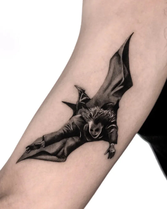 Medium Black and Grey Joker Bat on Men Arm Tattoo by @kenneth.ink
