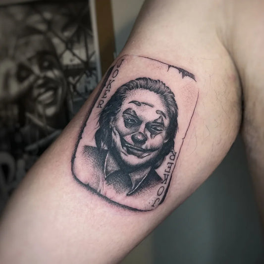 Medium Black and Grey Joker Card on Men Arm Tattoo by @blot_tattoo