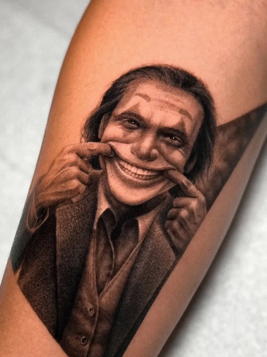 Medium Black and Grey Joker Portrait on Men Arm Tattoo by @jaris_ink