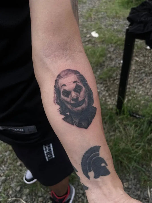 Medium Black and Grey Joker Portrait on Men Arm Tattoo by @karlvtattoo