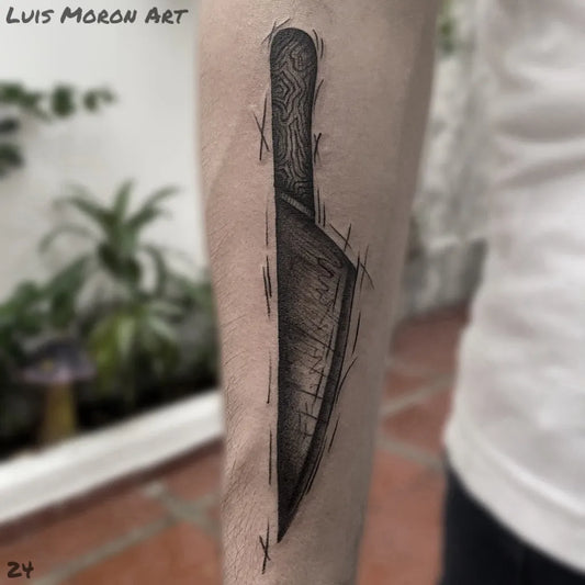 Medium Black and Grey Knife Tattoo on Men Arm by @artista_luis_moron