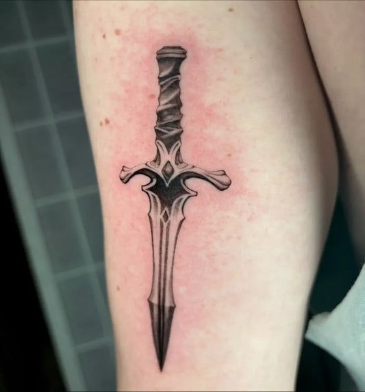 Medium Black and Grey Knife Tattoo on Women Arm by @esmeegodfreytattoos