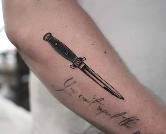 Medium Black and Grey Knife and Script Tattoo on Men Arm by @frankrochatattoo