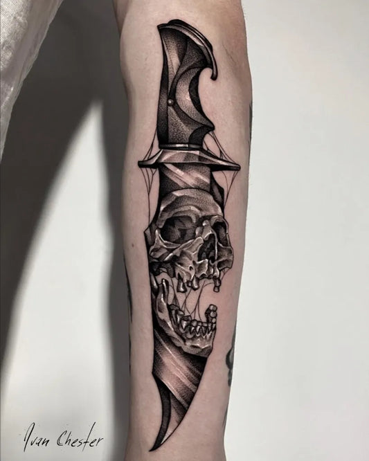 Medium Black and Grey Knife and Skull Tattoo on Men Arm by @ivan_chester