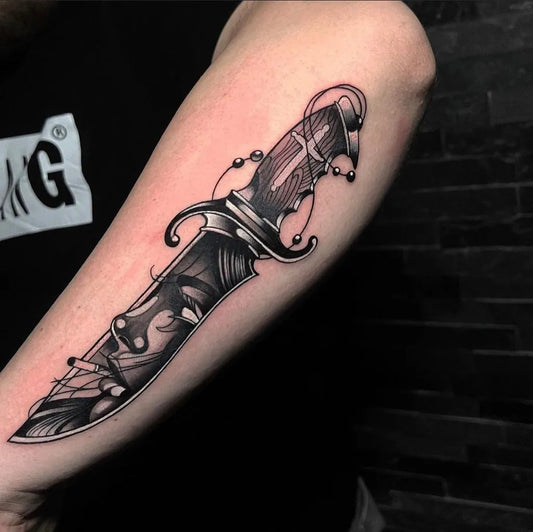 Medium Black and Grey Knife with Beads and Vines Tattoo on Men Arm by @strahinja_vukas_tattoons