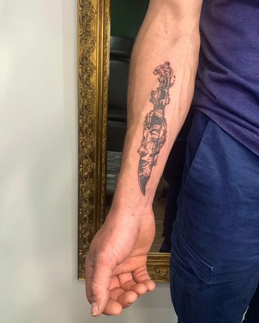 Medium Black and Grey KnifeTattoo on Men Arm by @axelle_ink