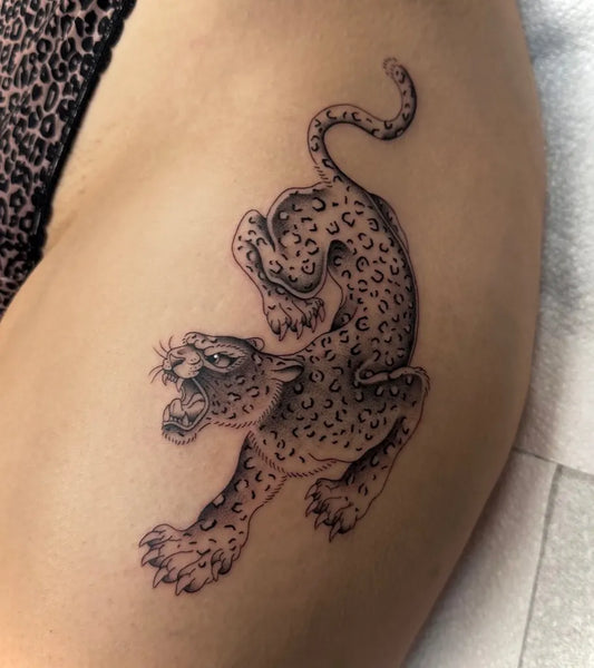 Medium Black and Grey Leopard on Women Thigh Tattoo by @lilymaytattoo