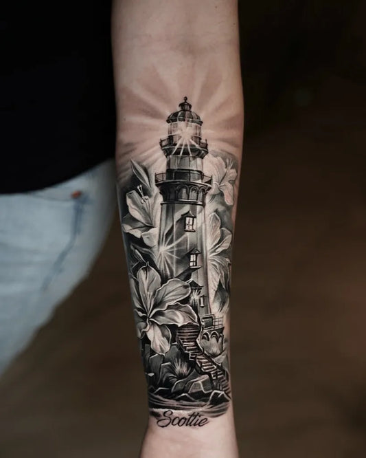 Medium Black and Grey Lighthouse and Flowers Tattoo on Men Arm by @aurum_inks
