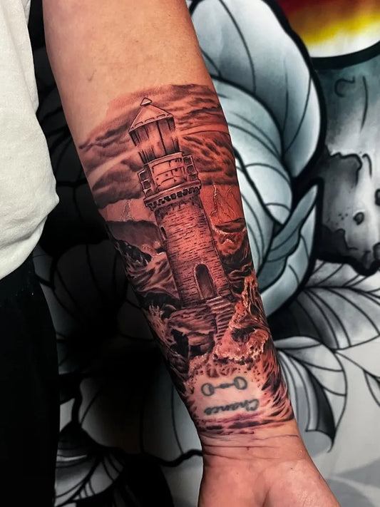 Medium Black and Grey Lighthouse and Rocky Cliff Tattoo on Men Arm by @bootyfunkofficial