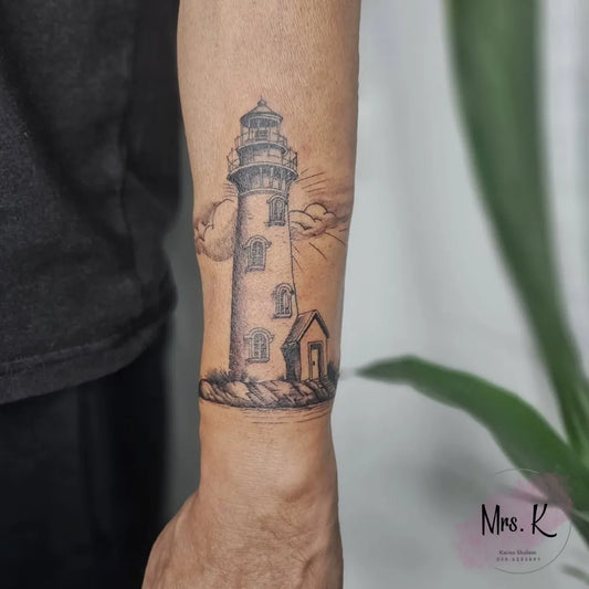 Medium Black and Grey Lighthouse with Clouds and Cottage Tattoo on Men Arm by @mrs_k_tatts