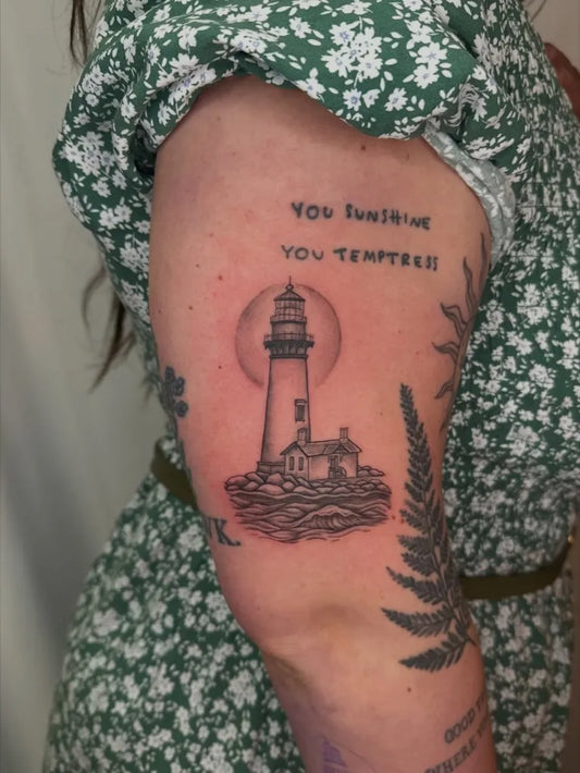 Medium Black and Grey Lighthouse with Fern Tattoo on Women Arm by @violetvixenink