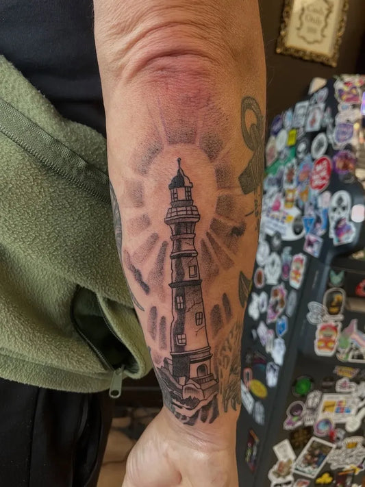 Medium Black and Grey Lighthouse with Rays Tattoo on Men Arm by @jjink902