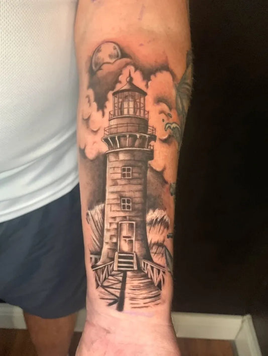 Medium Black and Grey Lighthouse with Waves and Clouds Tattoo on Men Arm by @lauraink11