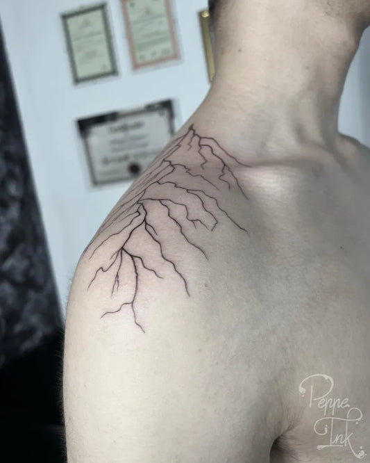 Medium Black and Grey Lightning Bolts Tattoo on Men Shoulder by @peppecatalano_tattoo