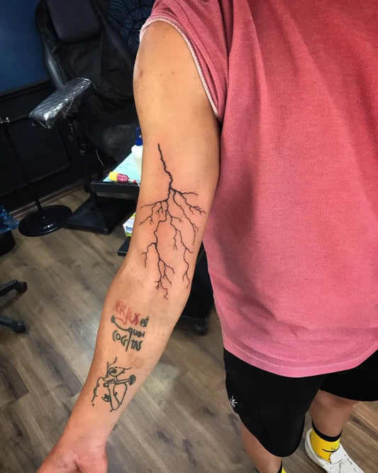 Medium Black and Grey Lightning and Arabic Script Tattoo on Men Arm by @tattooermerve