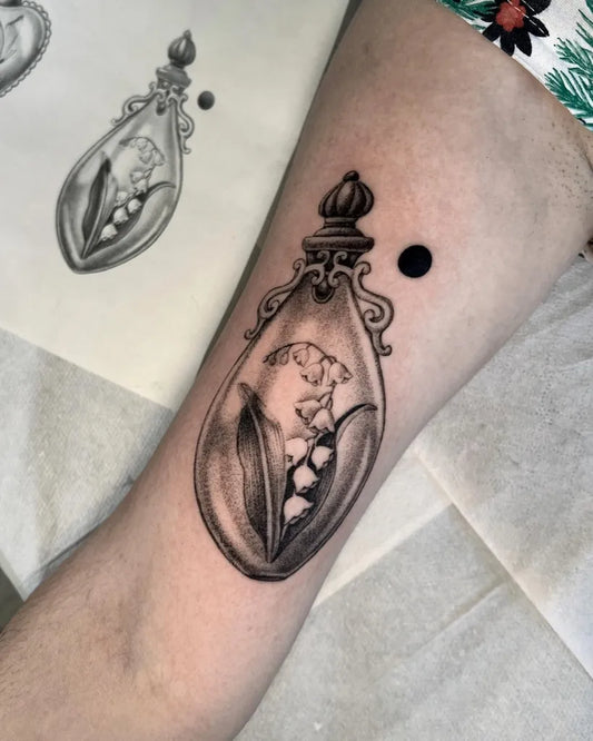 Medium Black and Grey Lily of the Valley Perfume Bottle on Women Arm Tattoo by @la__gatta