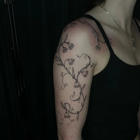 Medium Black and Grey Lily of the Valley Vine on Women Shoulder Tattoo by @jazzfoxtattoo