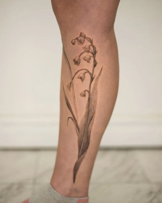 Medium Black and Grey Lily of the Valley Women Leg Tattoo by @suyscene