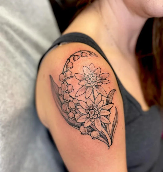 Medium Black and Grey Lily of the Valley and Edelweiss on Women Shoulder Tattoo by @leah_b_tattoos