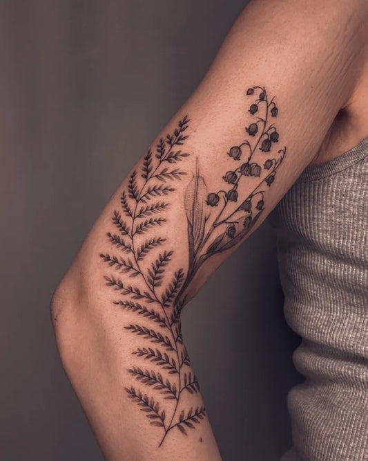 Medium Black and Grey Lily of the Valley and Ferns on Women Arm Tattoo by @cailintattoos