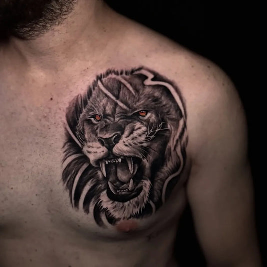 Medium Black and Grey Lion on Men Chest Tattoo by @tugaytattooartist