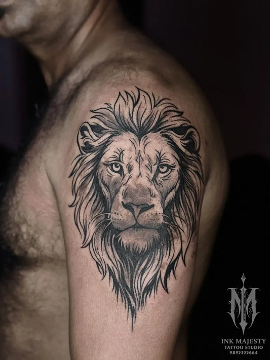 Medium Black and Grey Lion on Men Shoulder Tattoo by @tattoo_ink_majesty_taliparamba