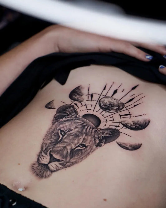 Medium Black and Grey Lion with Moons and Sun Tattoo on Women Stomach by @cause.chaos