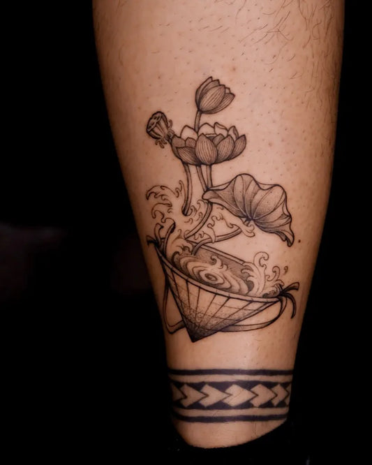 Medium Black and Grey Lotus Flower Teacup on Men Leg Tattoo by @chromeink.studio