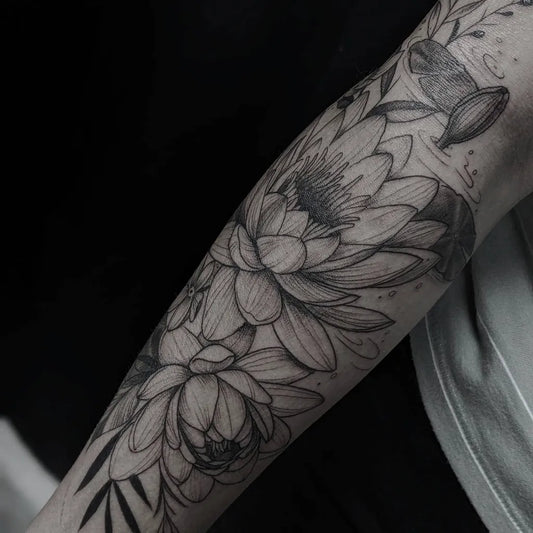 Medium Black and Grey Lotus Flower and Leaves on Women Arm Tattoo by @yeye_tattoos_