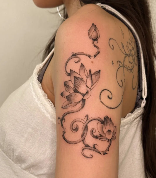 Medium Black and Grey Lotus Flower and Vines on Women Shoulder Tattoo by @amoreee.tattoo