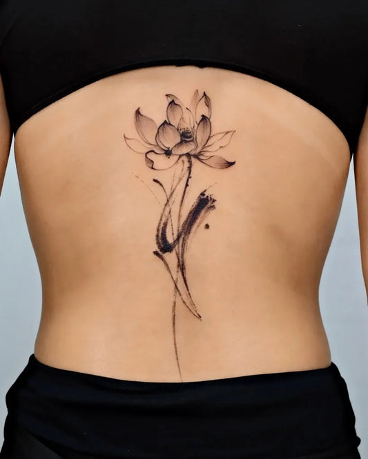 Medium Black and Grey Lotus Flower on Women Back Tattoo by @sansa.jr.tattoo
