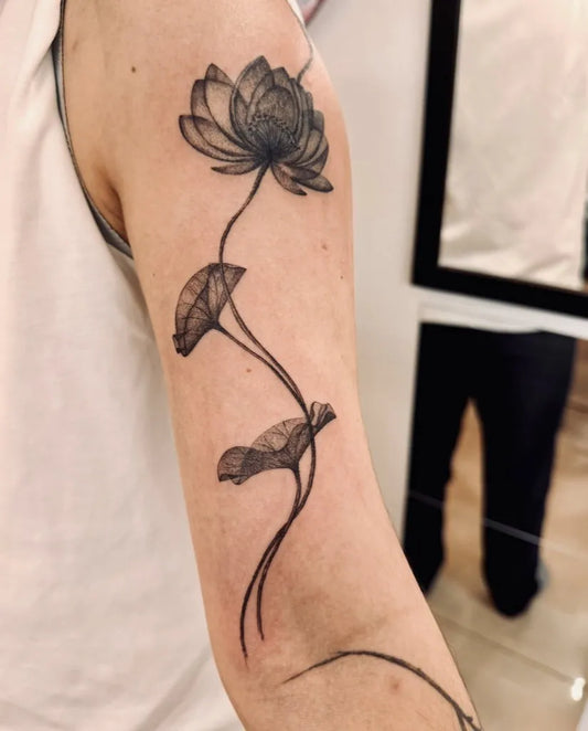 Medium Black and Grey Lotus Flower with Leaves on Women Arm Tattoo by @bnanatattoo