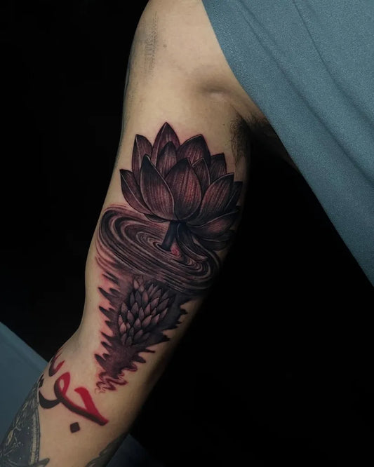 Medium Black and Grey Lotus Flower with Water Ripples and Arabic Script on Men Arm Tattoo by @erwin.loyola