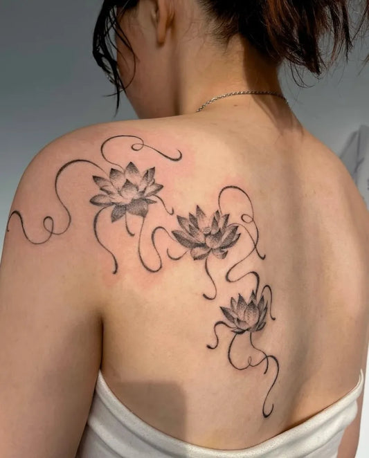 Medium Black and Grey Lotus Flowers on Women Shoulder Tattoo by @inkedbyjdo