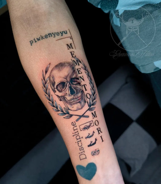 Medium Black and Grey Memento Mori Skull with Laurel and Text on Women Arm Tattoo by @guerrerostattoo