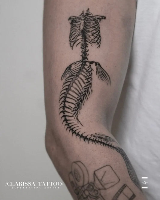 Medium Black and Grey Mermaid Skeleton Tattoo on Women Arm by @_projectartemis