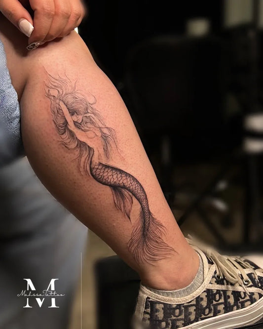 Medium Black and Grey Mermaid Tattoo on Women Thigh by @mahsatattoo.ink