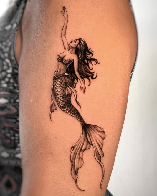 Medium Black and Grey Mermaid Tattoo on Women Upper Arm by @greta_mosca