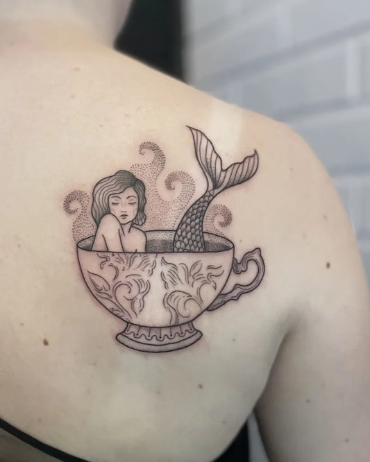 Medium Black and Grey Mermaid in Teacup Tattoo on Women Shoulder by @pikkumuusa
